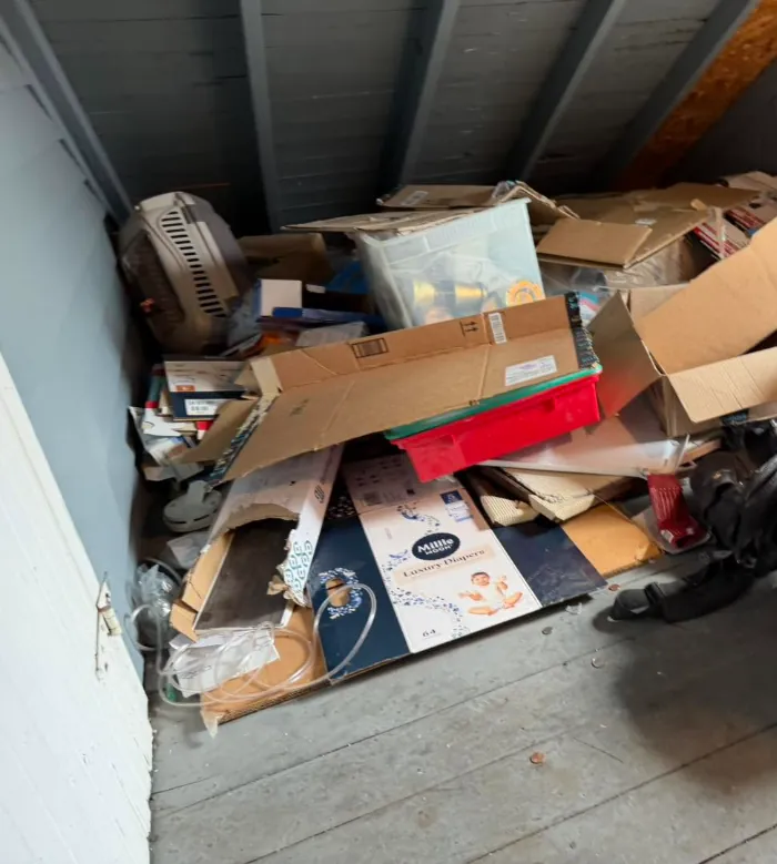 Attic floor covered in boxes and cardboard