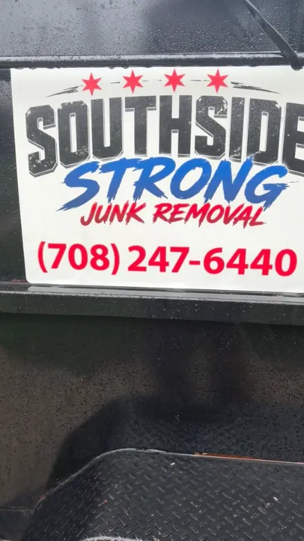 Southside Strong Junk Removal sign with the phone number (708) 247-6440 on the side of the trailer